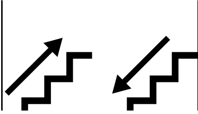 Two arrows on stairs — one ascending, one descending